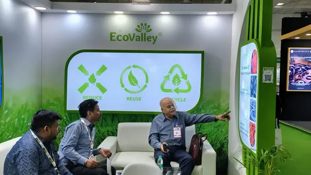 Visitor conversation at the EcoValley booth, Rubber Expo 2025